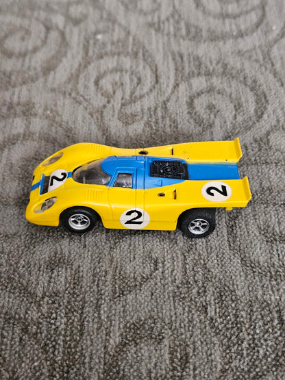 Vintage Aurora AFX Porsche Yellow/Blue #2 HO SLOT CAR
