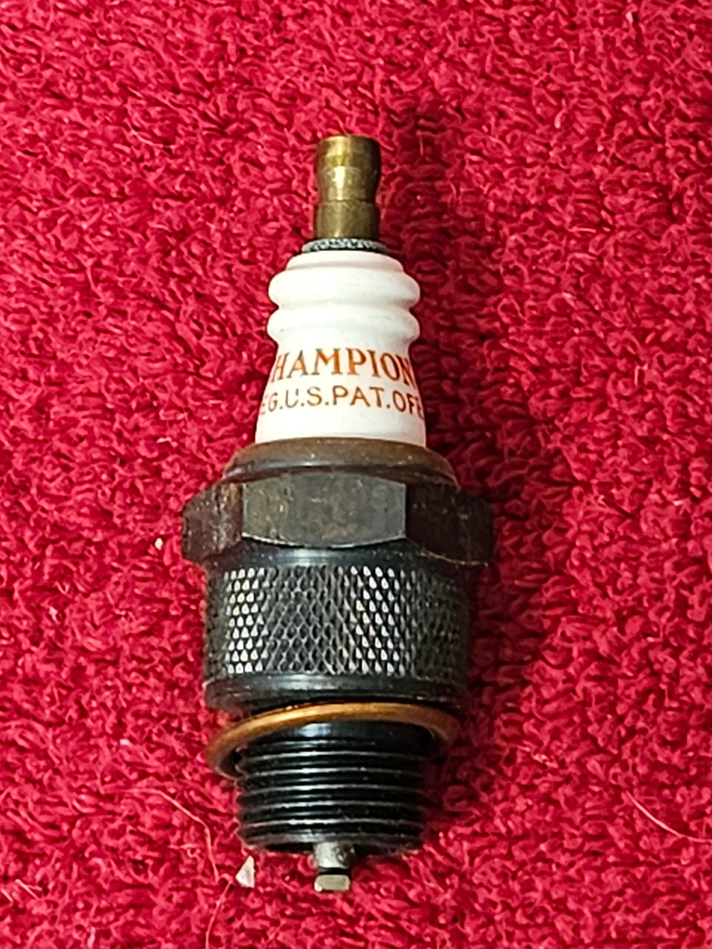Champion 6 Com spark plug close-up 18mm