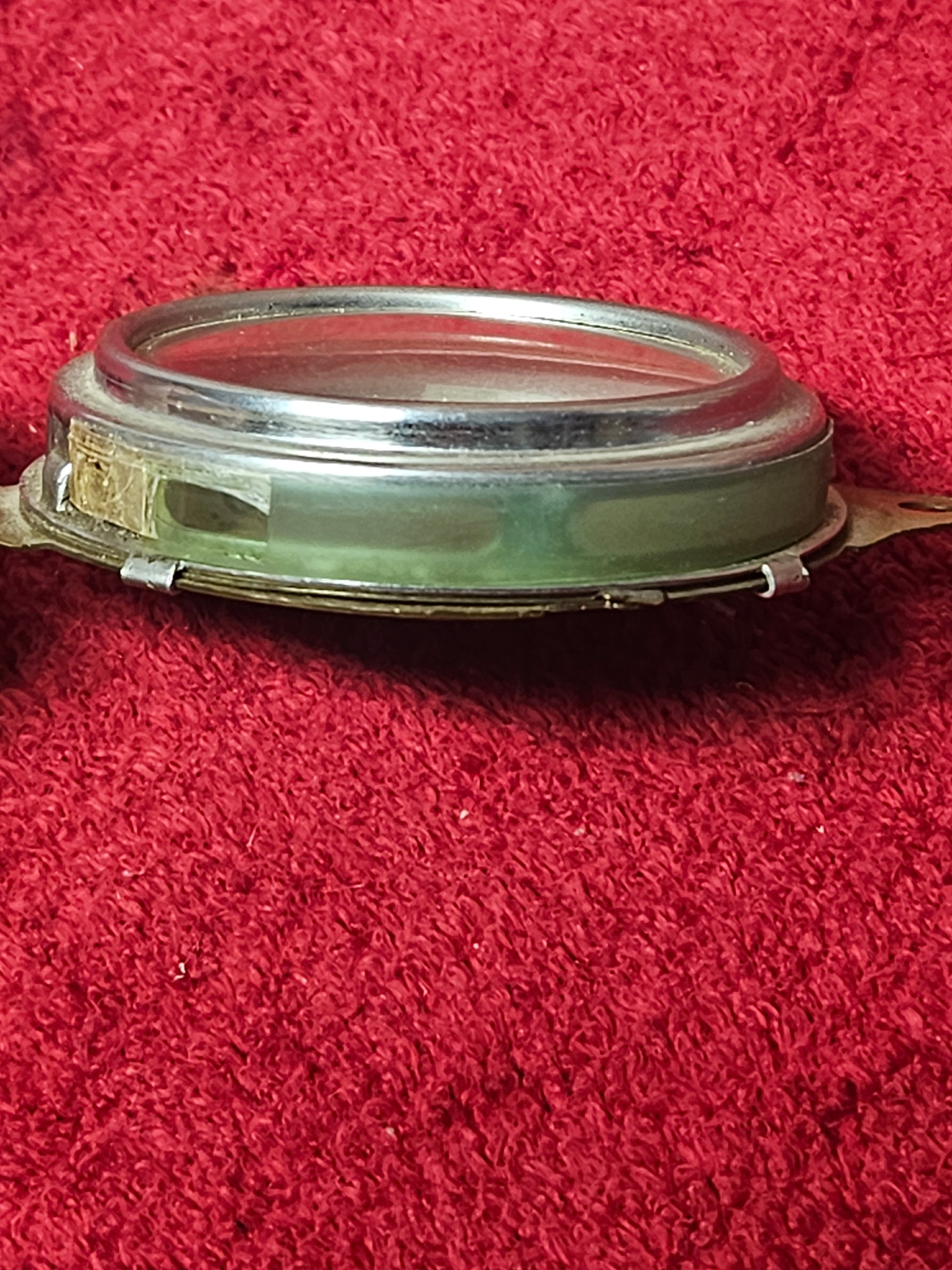 Edge view of Ford ammeter showing bezel depth and glass