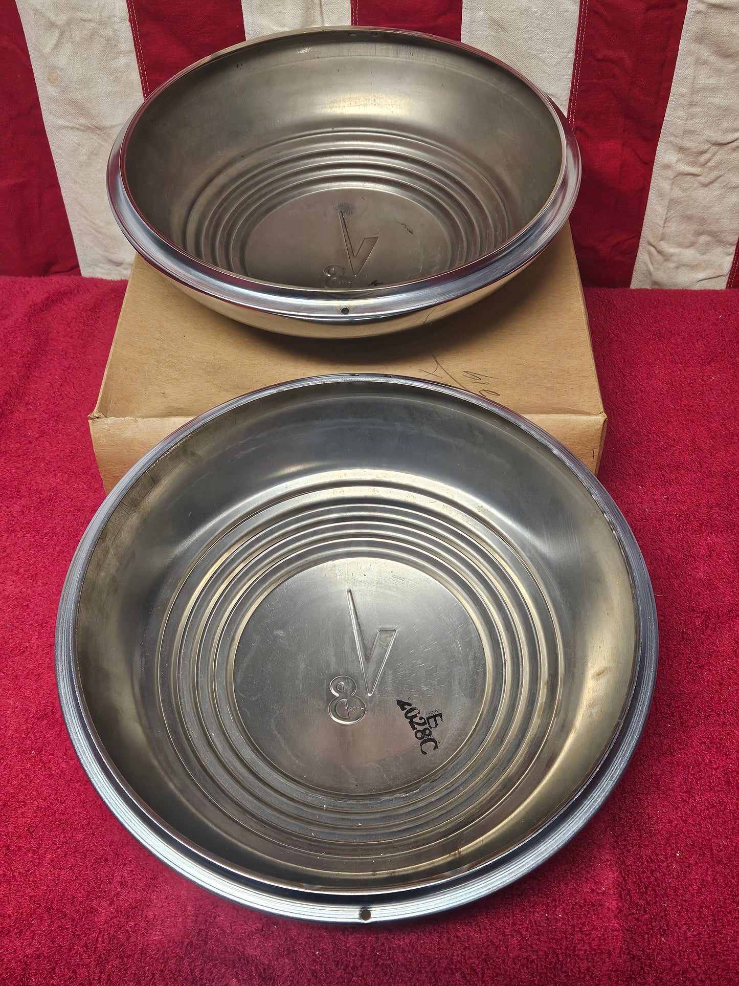 Reverse of both Ford V8 wide five hubcaps showing 2028C ink stamps