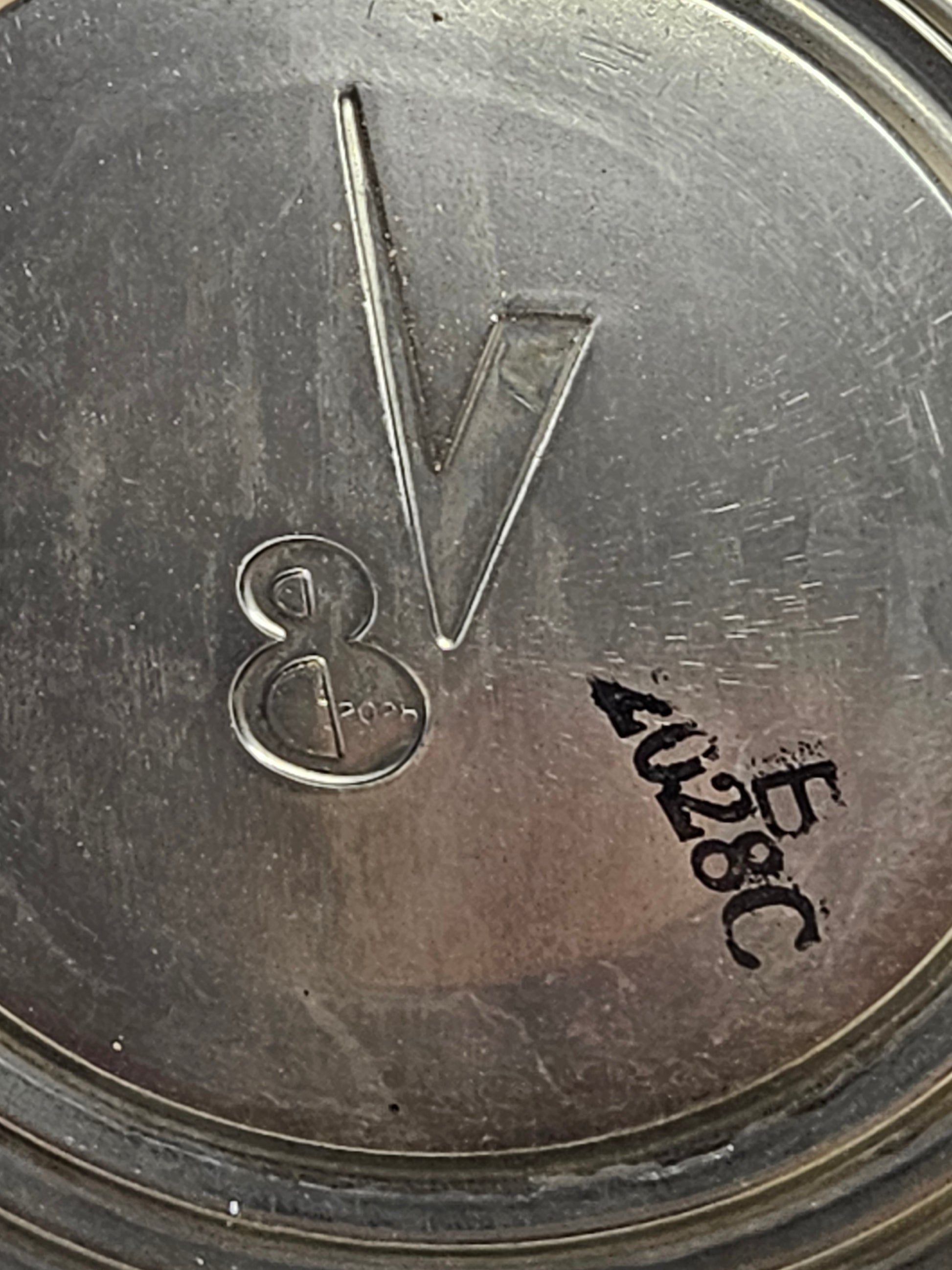 2028C ink stamp inside hubcap next to embossed Ford V8 script