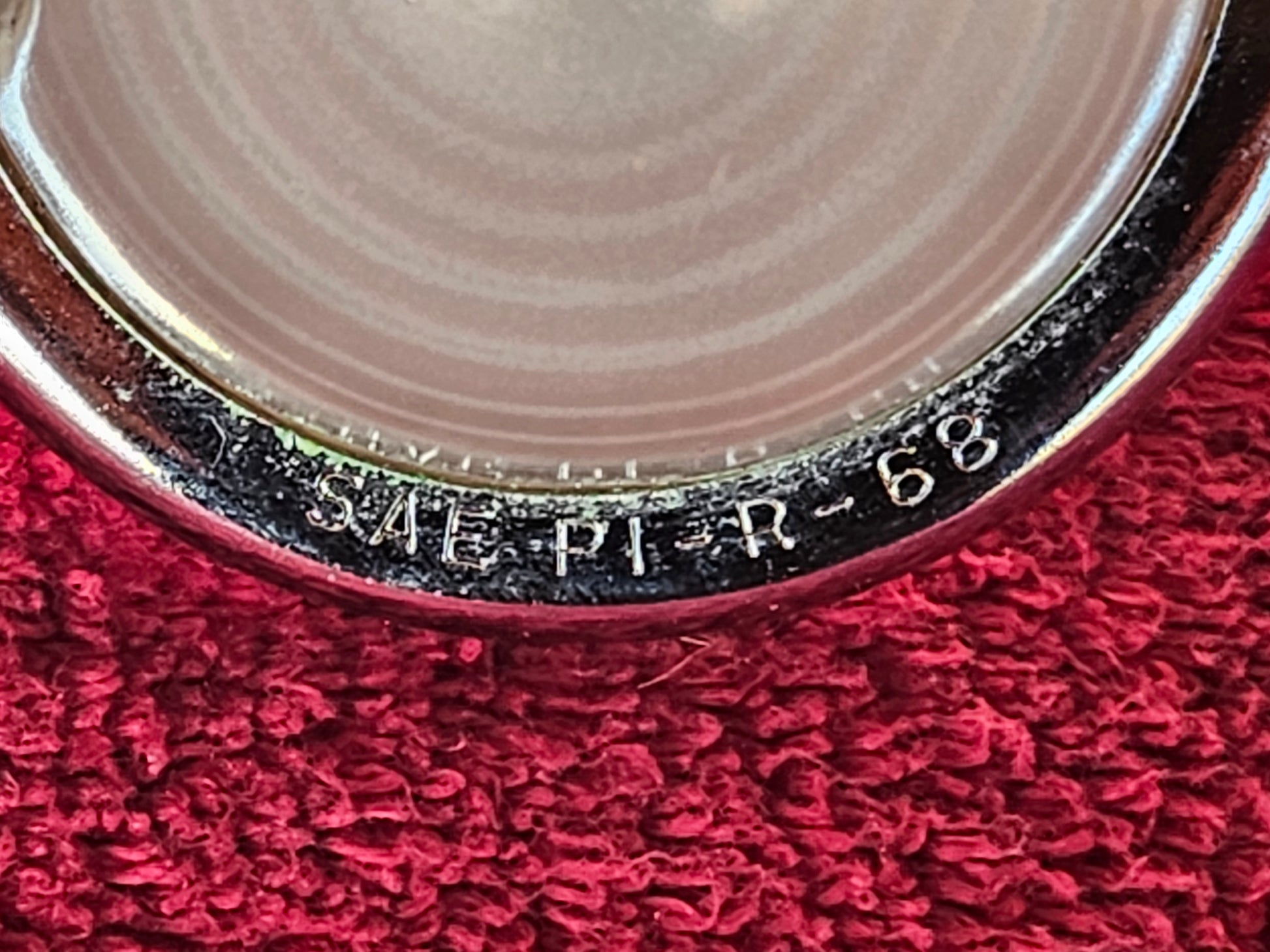 Lens ring embossed SAE PI R 68
