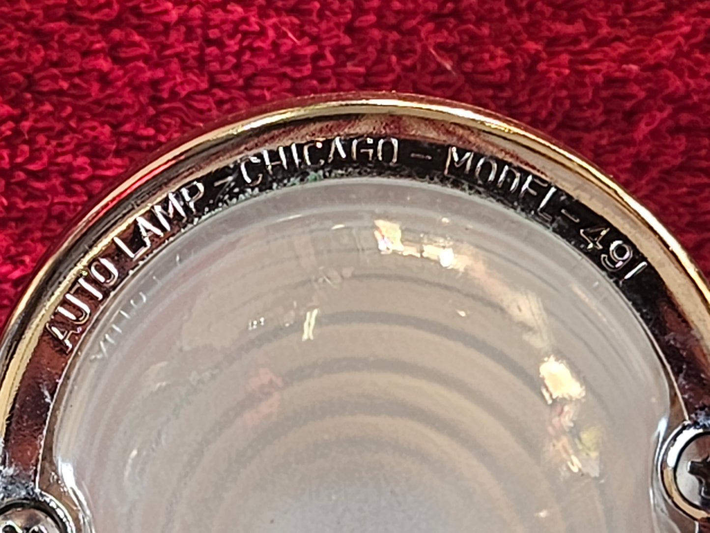 Lens ring embossed AUTO LAMP CHICAGO MODEL 491