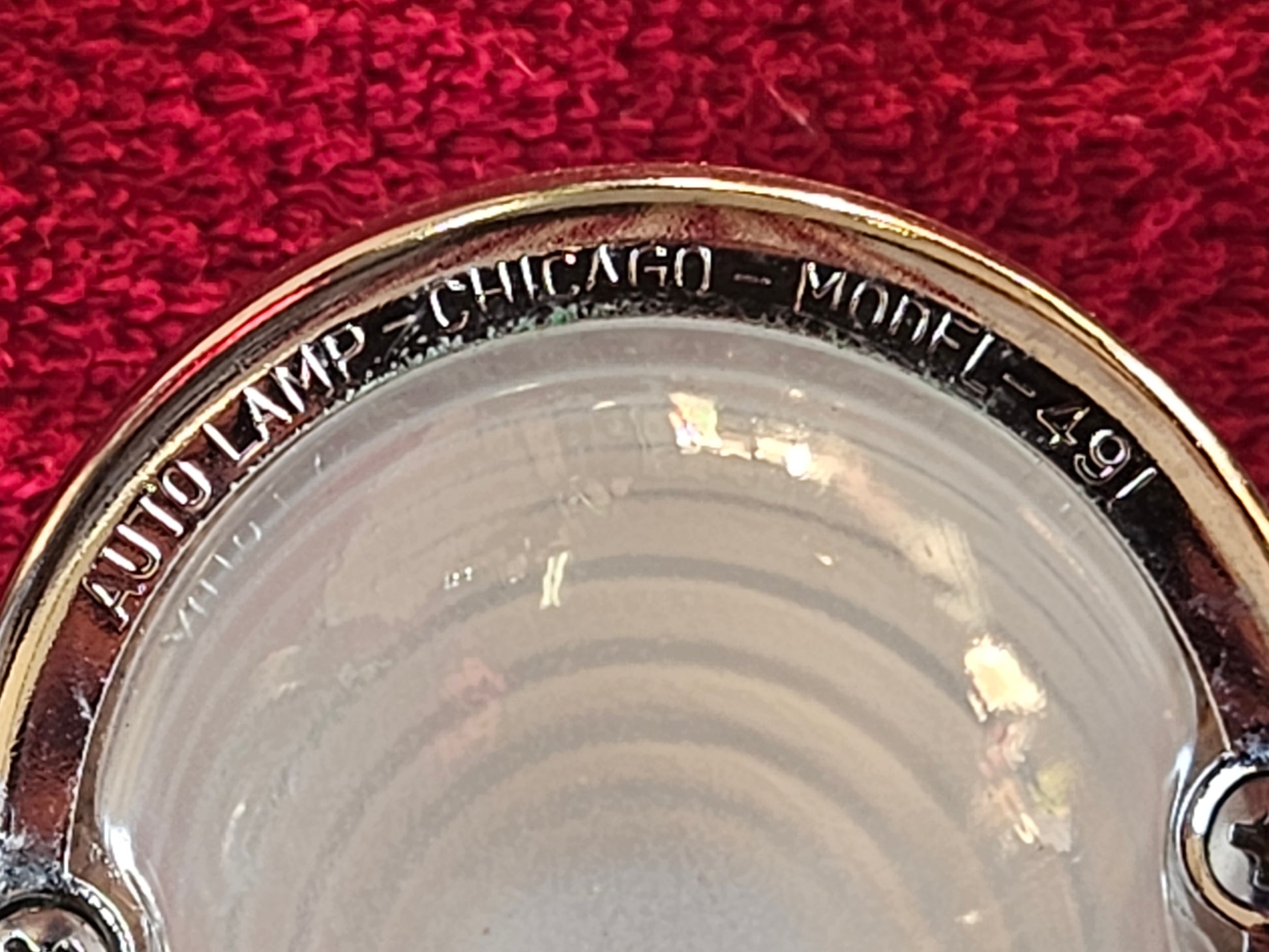 Lens ring embossed AUTO LAMP CHICAGO MODEL 491