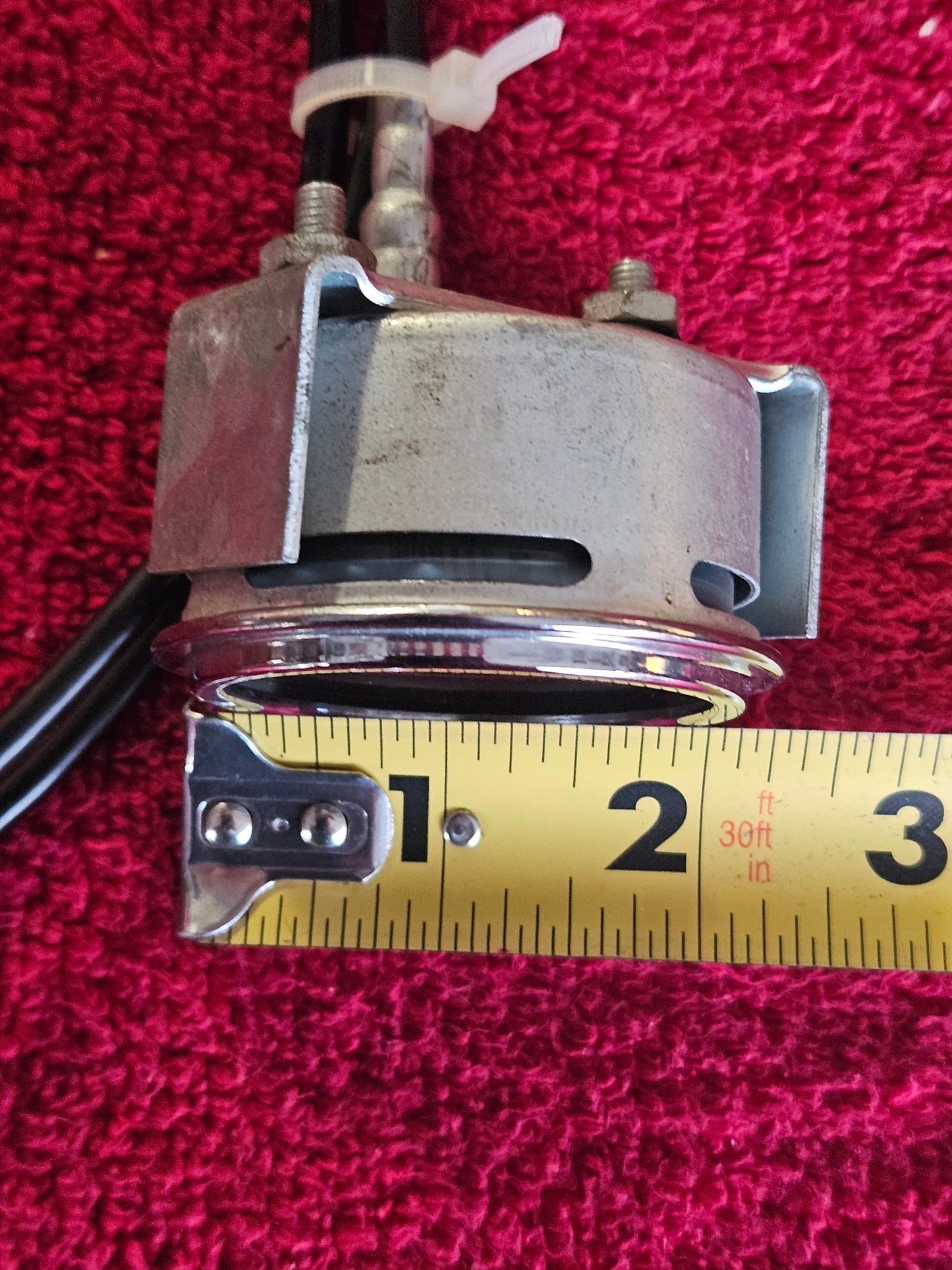 Stewart Warner gauge measured against a tape confirming 2-1/8 inch face