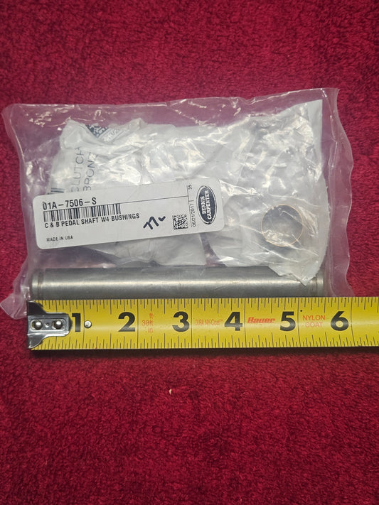 Dennis Carpenter 01A-7506-S clutch and brake pedal shaft set shown against a tape measure, approximately 5-1/2 inches