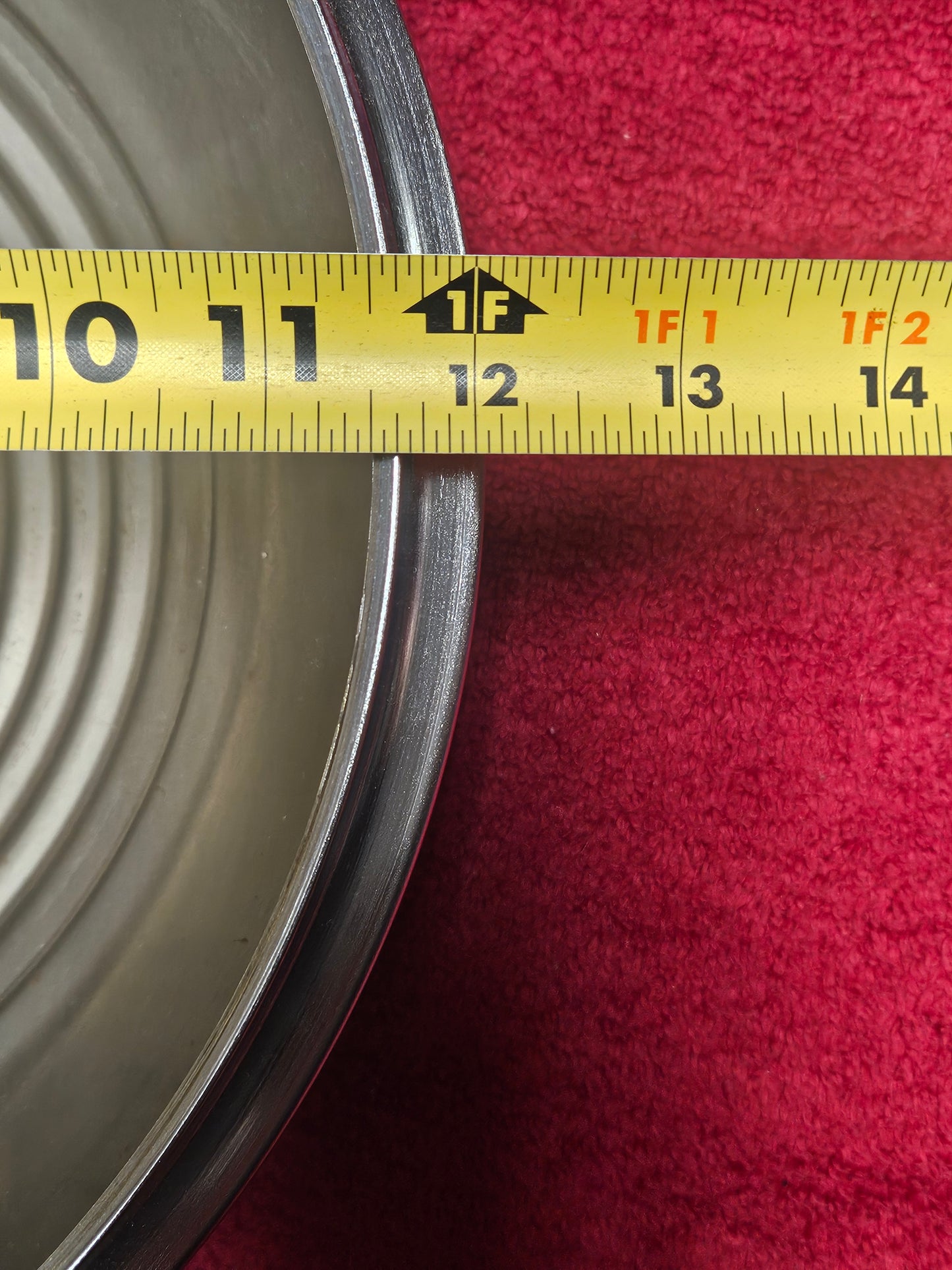 Close view of hubcap rim showing depth of nickel and chrome plating