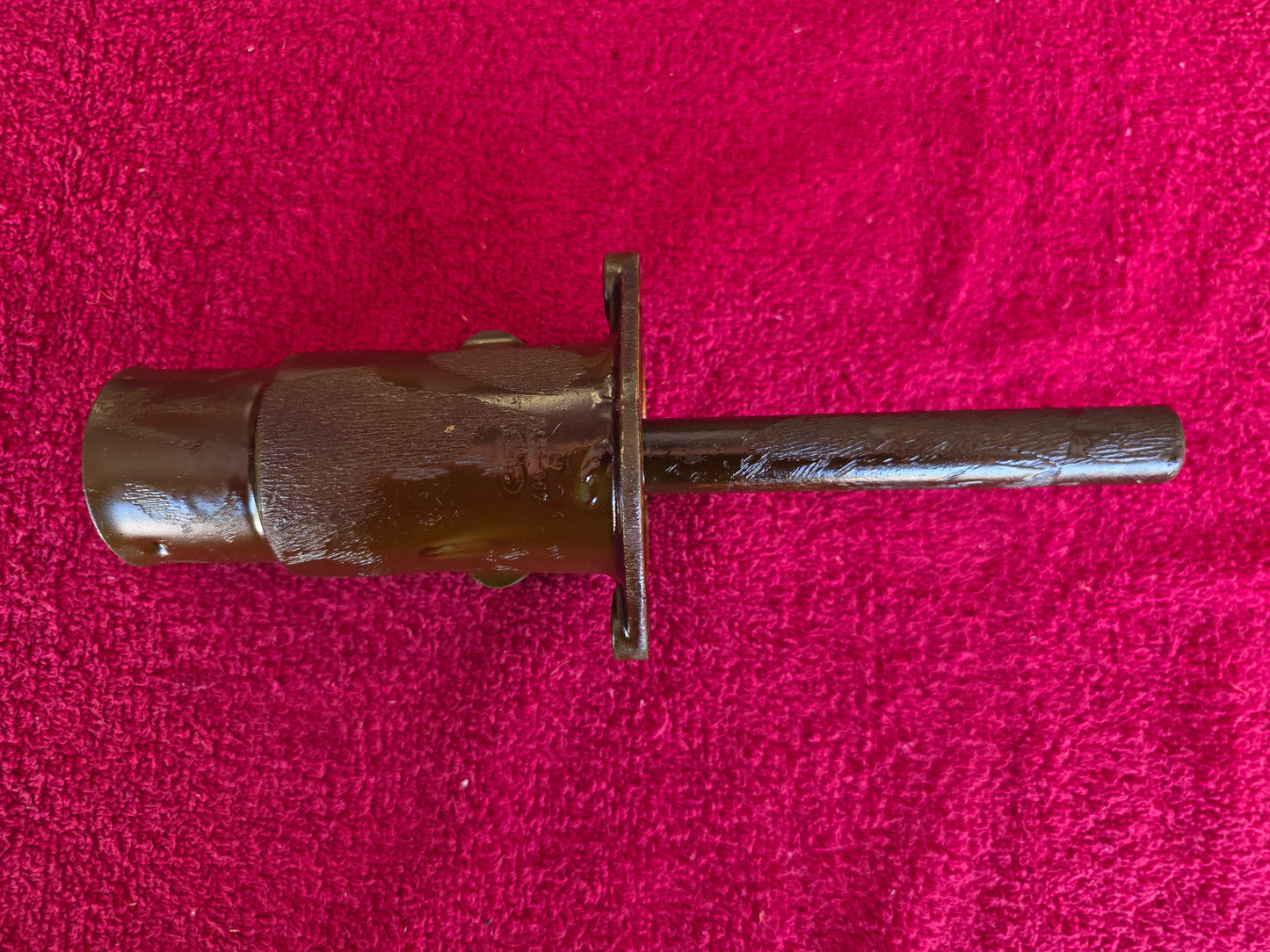 Opposite side of the fuel pump stand showing the stamped mark on the barrel under the cosmoline