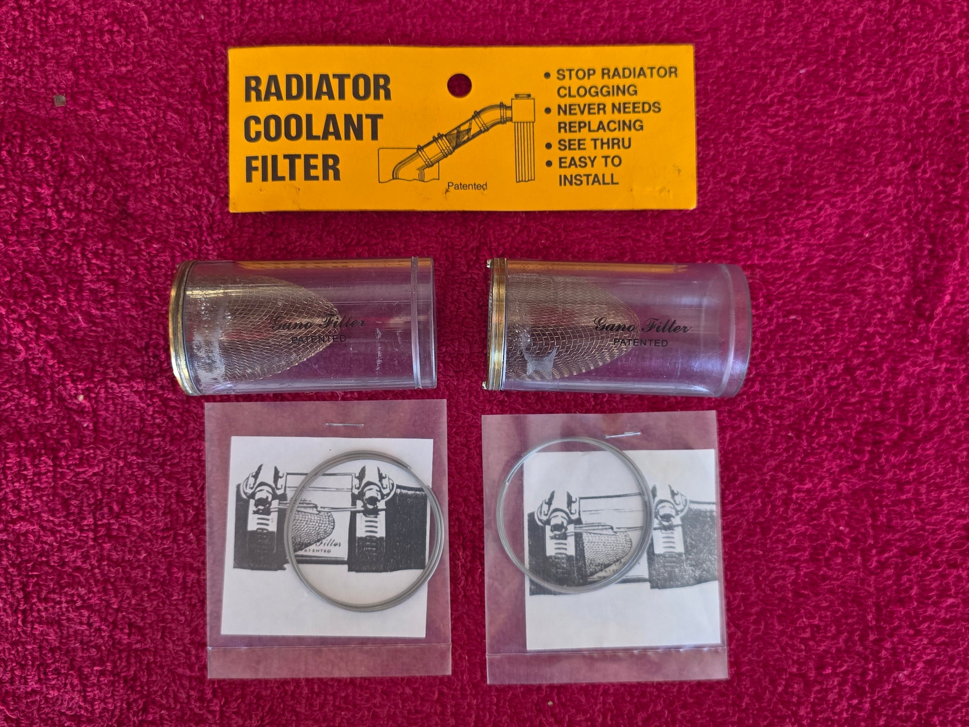 Two Gano Filter medium coolant filters with the yellow header card and both sealed stainless lashing wires