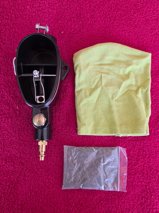 Abrasive spark plug cleaner with its cloth collection bag and sealed bag of abrasive media