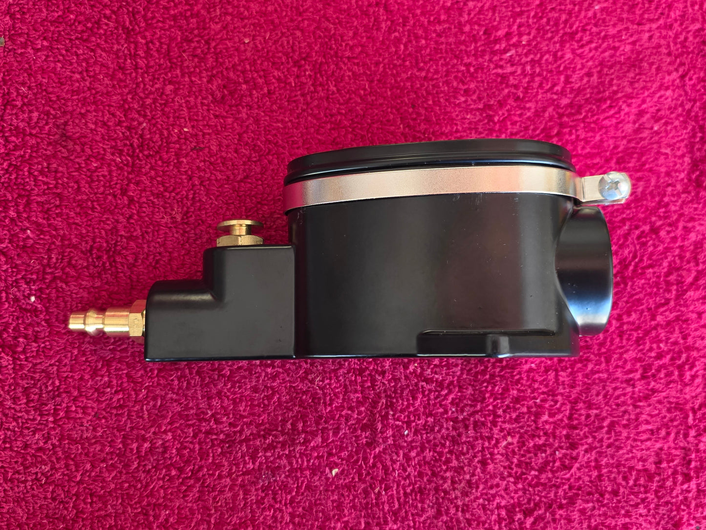 Opposite side of the spark plug cleaner body and the brass inlet fitting