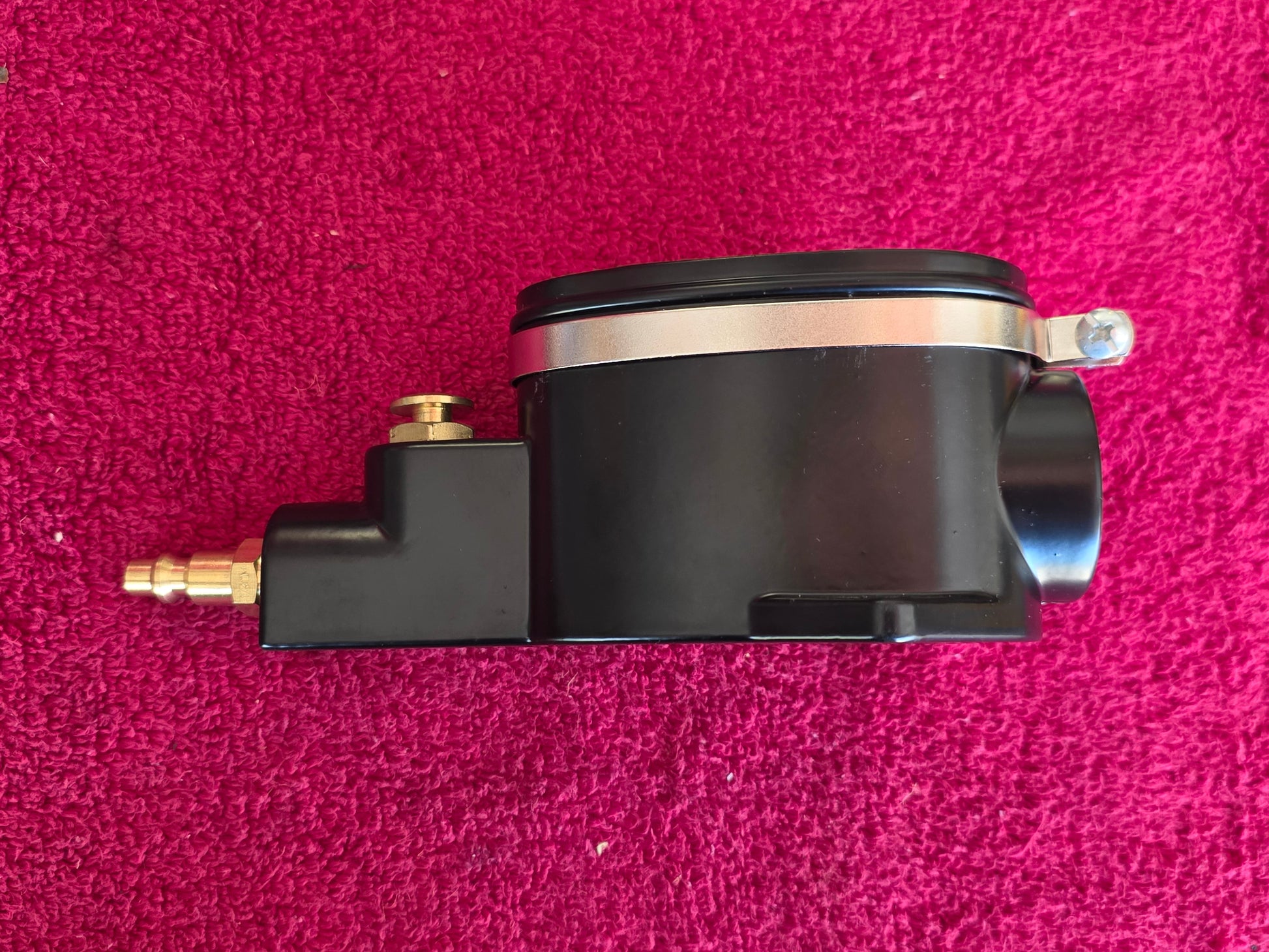 Opposite side of the spark plug cleaner body and the brass inlet fitting