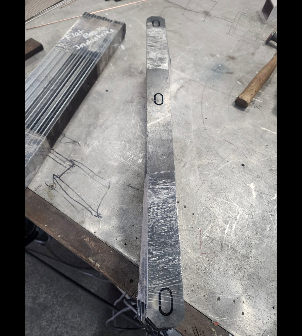 Single flat bracket blank before forming